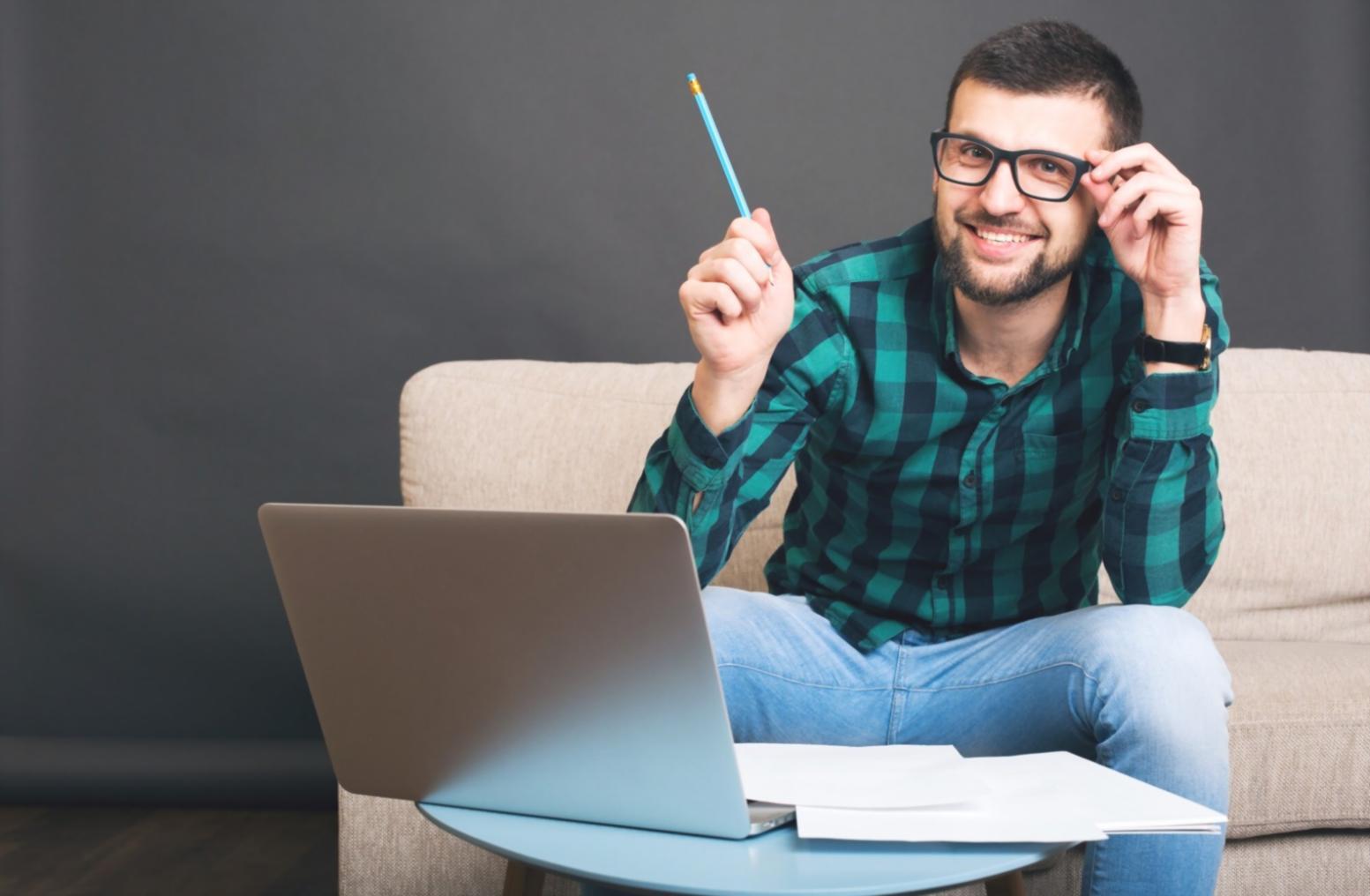 Person reviewing budget documents and calculations on desk