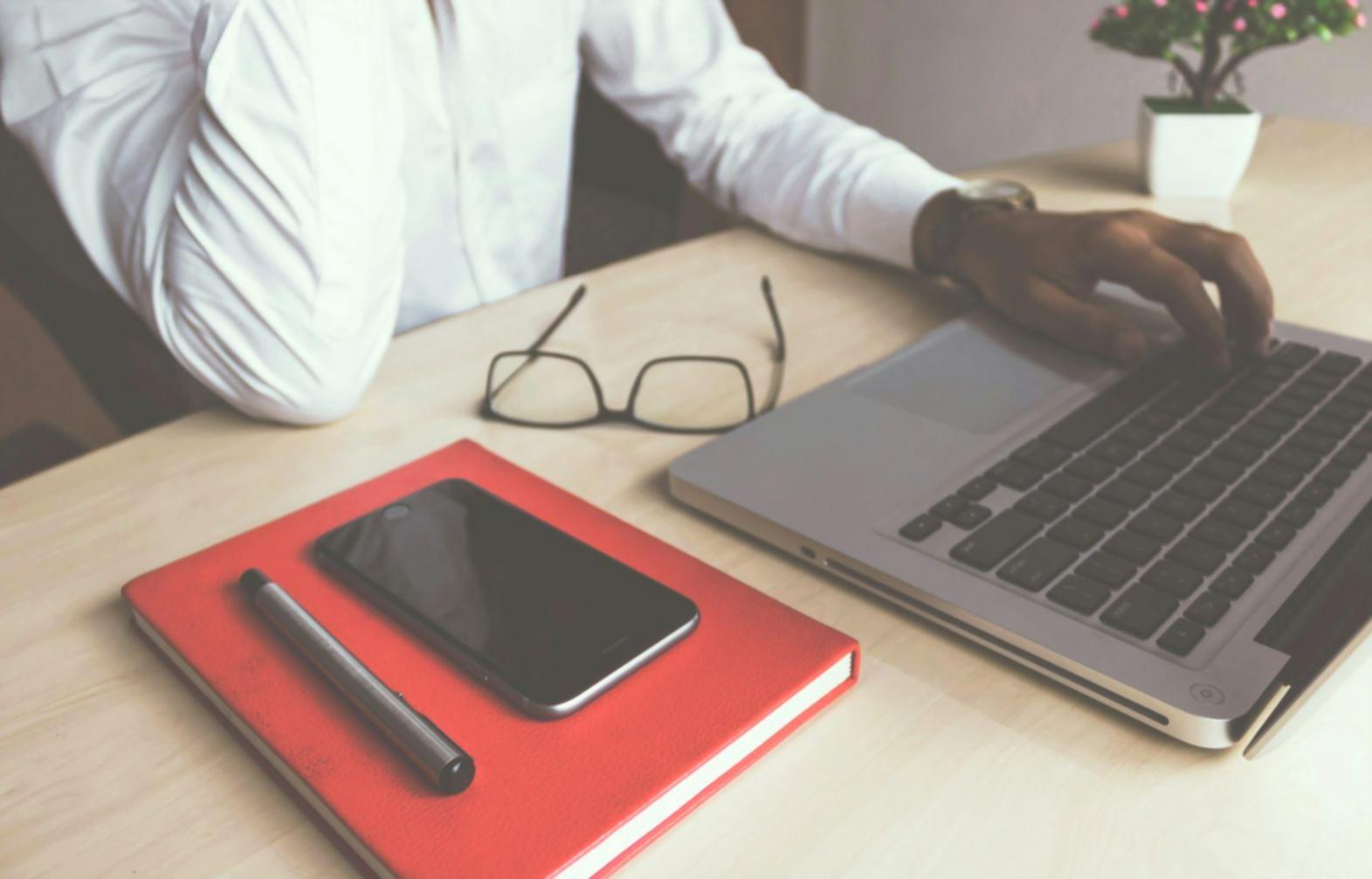 Comprehensive budget analysis spreadsheets and financial planning documents spread across desk workspace
